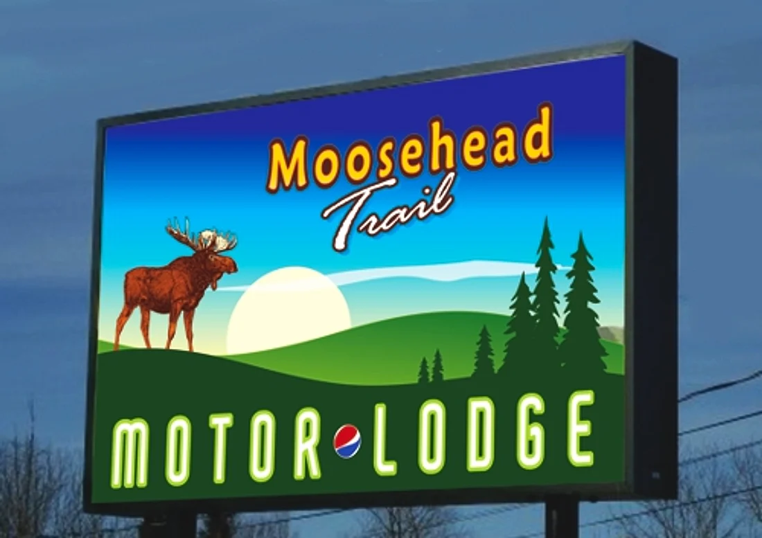 A lighted cabinet sign reading “Moosehead Trail Motor Lodge” with a full-colour illustrated moose graphic, built by Tango Signs